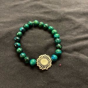 green bracelet with flower charm
